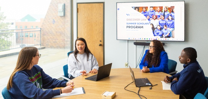 People sitting at a table having a discussion.