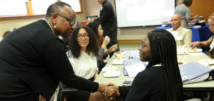 Alumni with students.