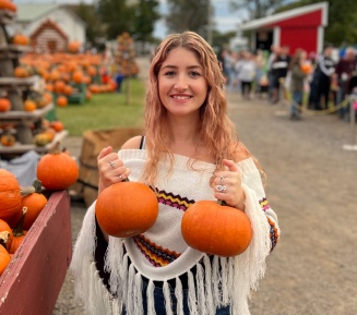 Hannah outside wearing a cap.