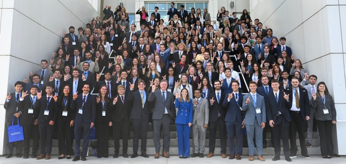 The entire incoming 3-year JD Class standing on a large set of stairs outside UB's Center for the Arts.