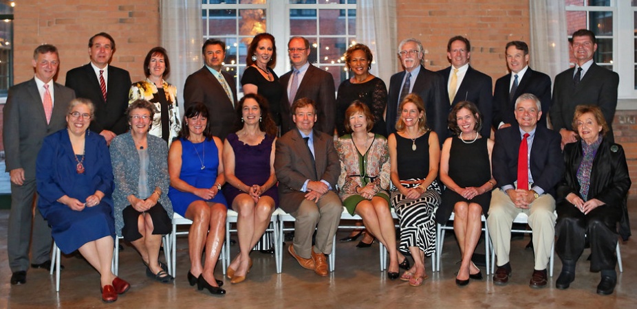 Group of people sitting together for a photo. 