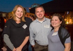 three people smiling. 