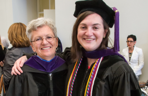 two women, smiling. 