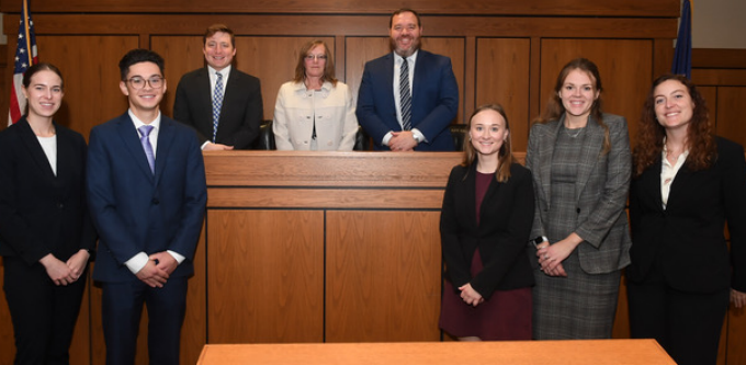 Zoom image: 2023 Desmond Competition First Row: Left to Right: Katherine Kio '25 &amp; Tyler Myszka '25 (Winning Team), Victoria Heist '24 &amp; Lexi Horton '24 (Runner-up Team), Haley Case '24, Buffalo Moot Court Board President Second Row: Left to Right: Prof. John Giammatteo; Prof. Lucinda M. Finley, Frank G. Raichle Professor of Trial and Appellate Advocacy; Director of Moot Courts, Sean C. Eldridge '10, U.S. Attorney, U.S. Attorney's Office, WDNY 