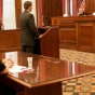 photo of students in a courtroom in a mock trial. 