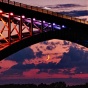 Peace bridge uniting the United States and Canada at moonrise. 