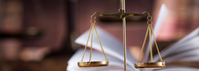 Scales with open book.