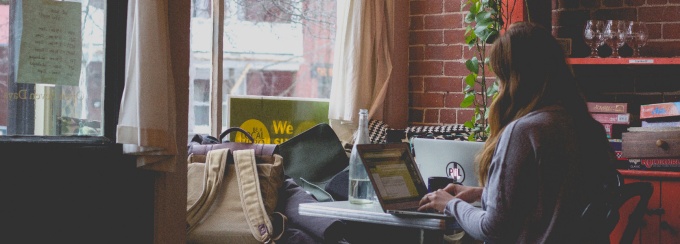 Photo of girl studying in a coffee shop.