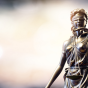 blurred photo of lady justice statue. 