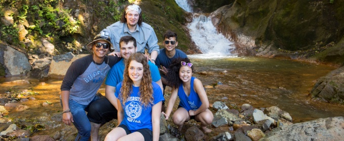 group of students in front of a waterfall in Costa Rico.