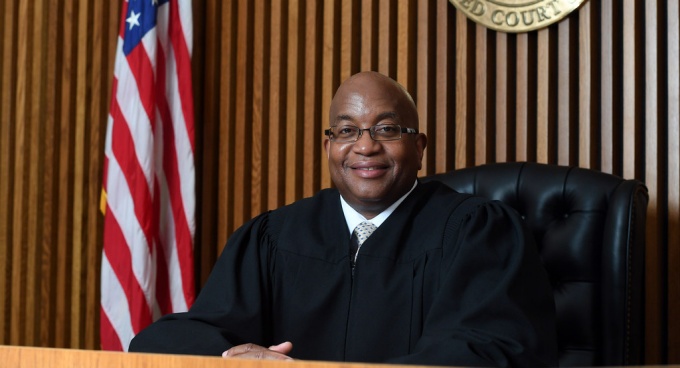 Hon. Craig Hannah sitting on the judges bench.