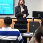 Man standing in front of a classroom of students. 