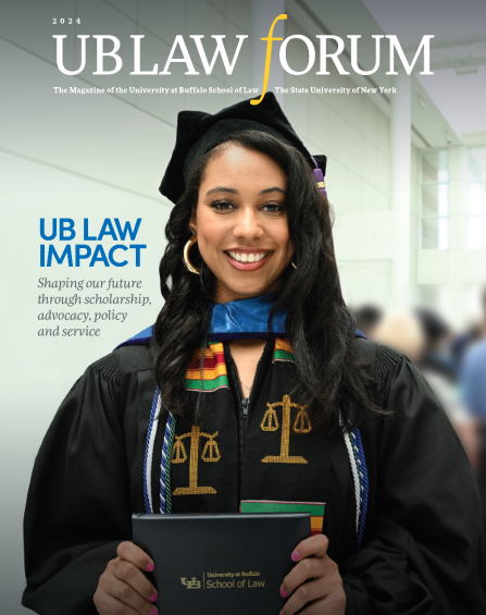 Cover of a UB Law Forum magazine showing a recent law school graduate wearing graduation regalia, smiling, holding her diploma. 