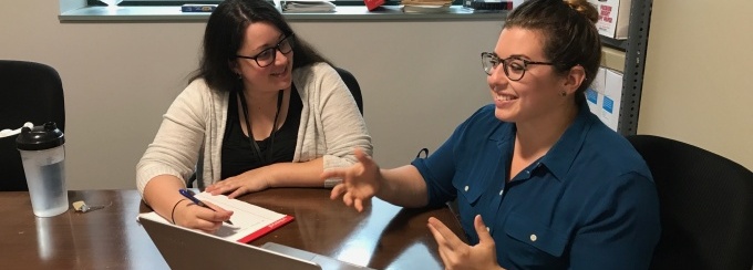 Bethany Cereo '18 training a new Family Justice Center advocate.