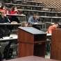 Photo of Professor Gardner teaching a classroom of undergraduate students. 