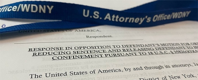 photo of a document and lanyard for the US Attorney's Office.