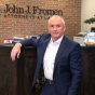 John J. Fromen Jr. ’87 in front of the reception desk at his practice. 