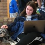 law student sitting with a dog. 