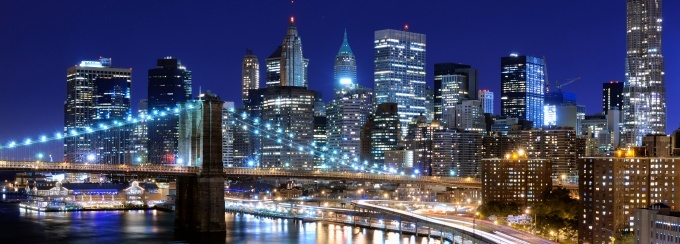 photo of new york city skyline at night.