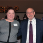 photo of Dean Abramovsky with a group of alumni smiling. 