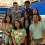 group of students standing in the library. 