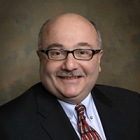 portrait photo of Hon. Lawrence J. Vilardo.