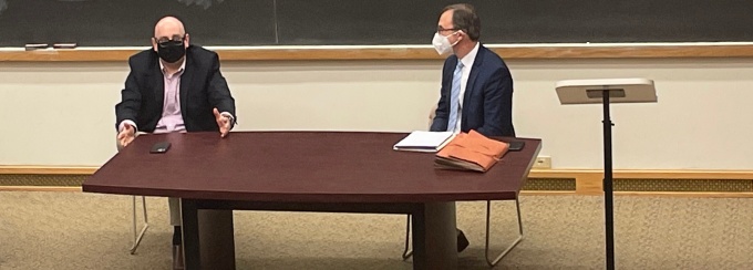 photo of two instructors conducting a class while wearing masks.