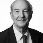 black and white photo of man smiling.