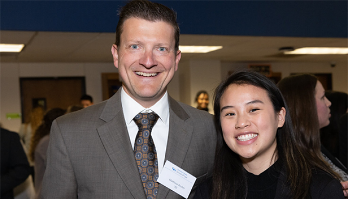 man and woman smiling.