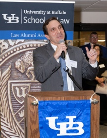 LAA Mentor Chair John C. Godsoe ’00 standing at a podium.