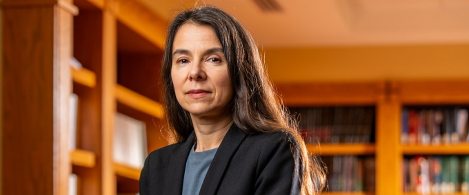 woman in a room with books.