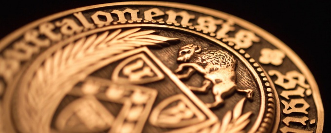 image of a bronze academic seal medallion.