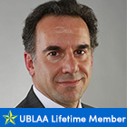 man, smiling with text under photo that says UBLAA Lifetime Member.