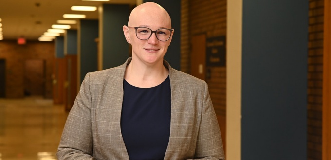 woman standing in a hallway.