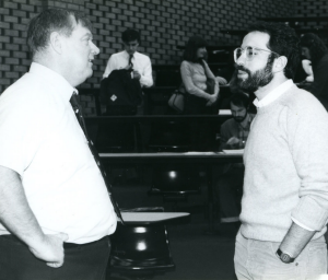 black and white photo of Prof. Joyce speaking with a law student after class.