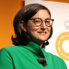 woman wearing a green blazer.