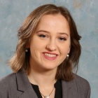 Young woman smiling.