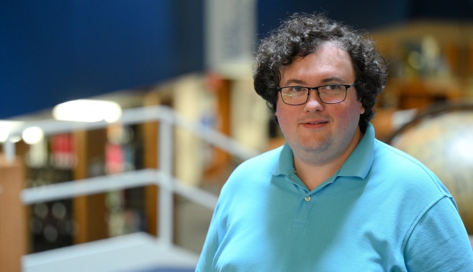 Zvieriev standing inside the main entrance of the law library.