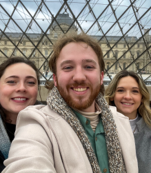 Zoom image: Ciara, Andrew and Katie outside the Louvre Museum in Paris. 