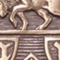 Close up photo of a bronze emblem. 