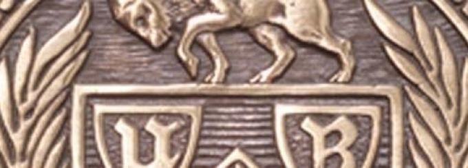 Closeup image of a bronze emblem.