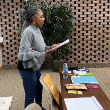 Zoom image: Prof. Pamela Newell reading instructions to the participants. [View more photos] 