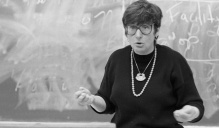 black and white photo of marcus teaching a class.