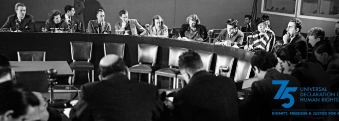 black and white photo of a round table discussion. 