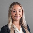 Cassidy Jensen wearing black jacket, smiling.