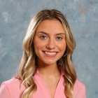 Mary Starr wearing pink top.