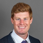 Andrew Atkinson wearing blue suit and tie.