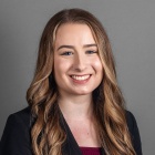 Michaela Fuchs wearing black jacket, smiling.