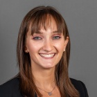 Jadan Torcello ’27 wearing blue jacket, white top.